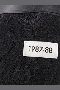 Dolce &amp; Gabbana women’s black lace midi skirt featuring a white label reading 1987-88 visible on the back side