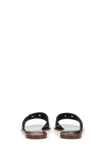 Dolce &amp; Gabbana women’s black leather slide sandal with gold-tone hardware and brown rubber sole
