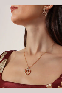 Dolce &amp; Gabbana women’s gold-tone heart-shaped pendant necklace with dangling dg logo and crystal accents