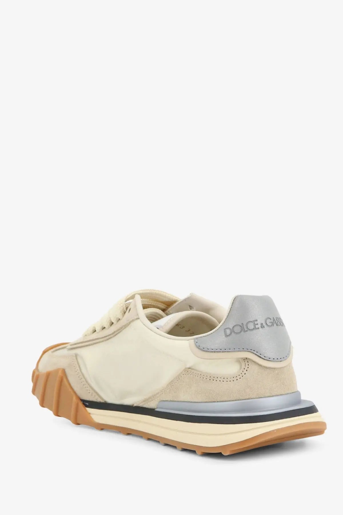 Cream-colored dolce &amp; gabbana women’s sneaker with suede and canvas upper gray heel tab and layered rubber sole