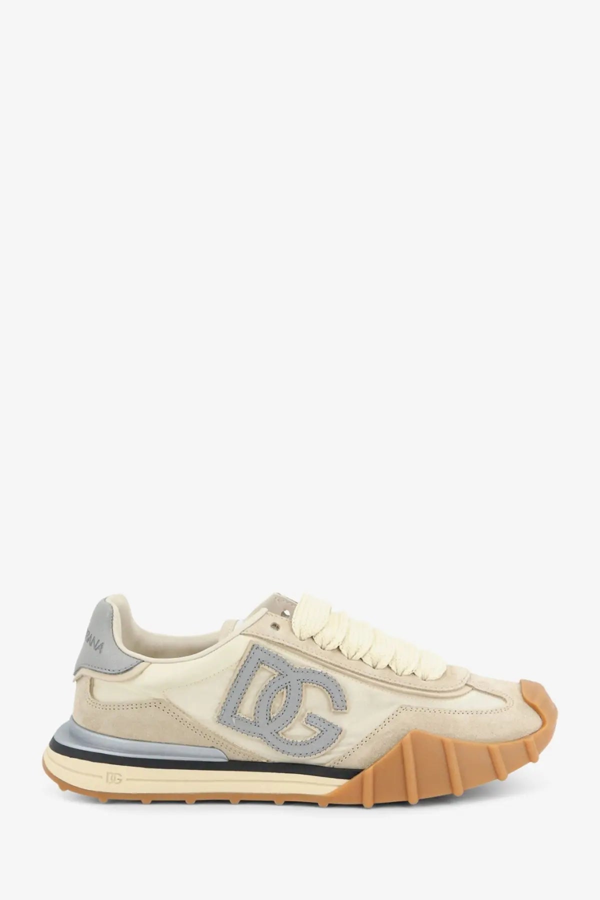 Dolce &amp; Gabbana women’s cream-colored suede sneaker with gray dc logo and tan rubber sole and midsole detail