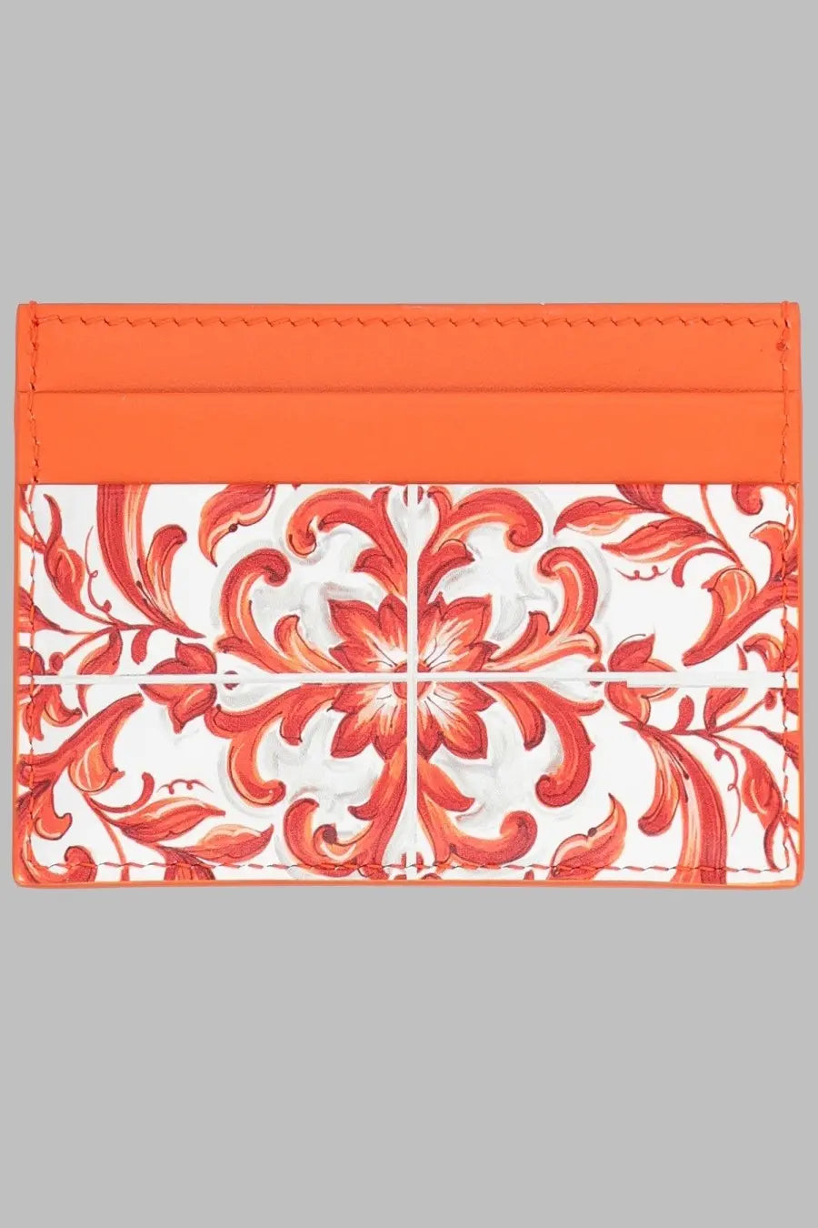 Dolce &amp; Gabbana women’s orange leather card holder with vibrant orange and white floral pattern and glossy finish