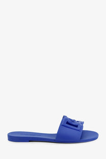 Dolce &amp; Gabbana women’s blue pvc slide sandal with a bright blue rubber sole and bold sculpted logo buckle