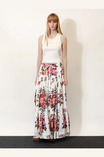 Dolce and gabbana women’s ribbed cotton white top paired with a flowing white maxi skirt with red pink and purple floral pattern