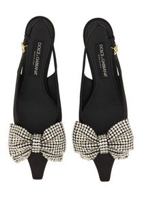 Dolce &amp; Gabbana women’s black satin slingback heels with a sparkling crystal bow at the toe