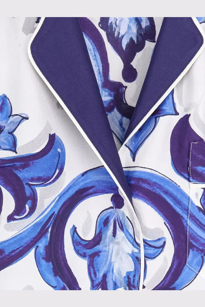 Dolce &amp; Gabbana women’s silk white pajama top with bold blue and purple floral patterns and navy inner lining edged in white trim