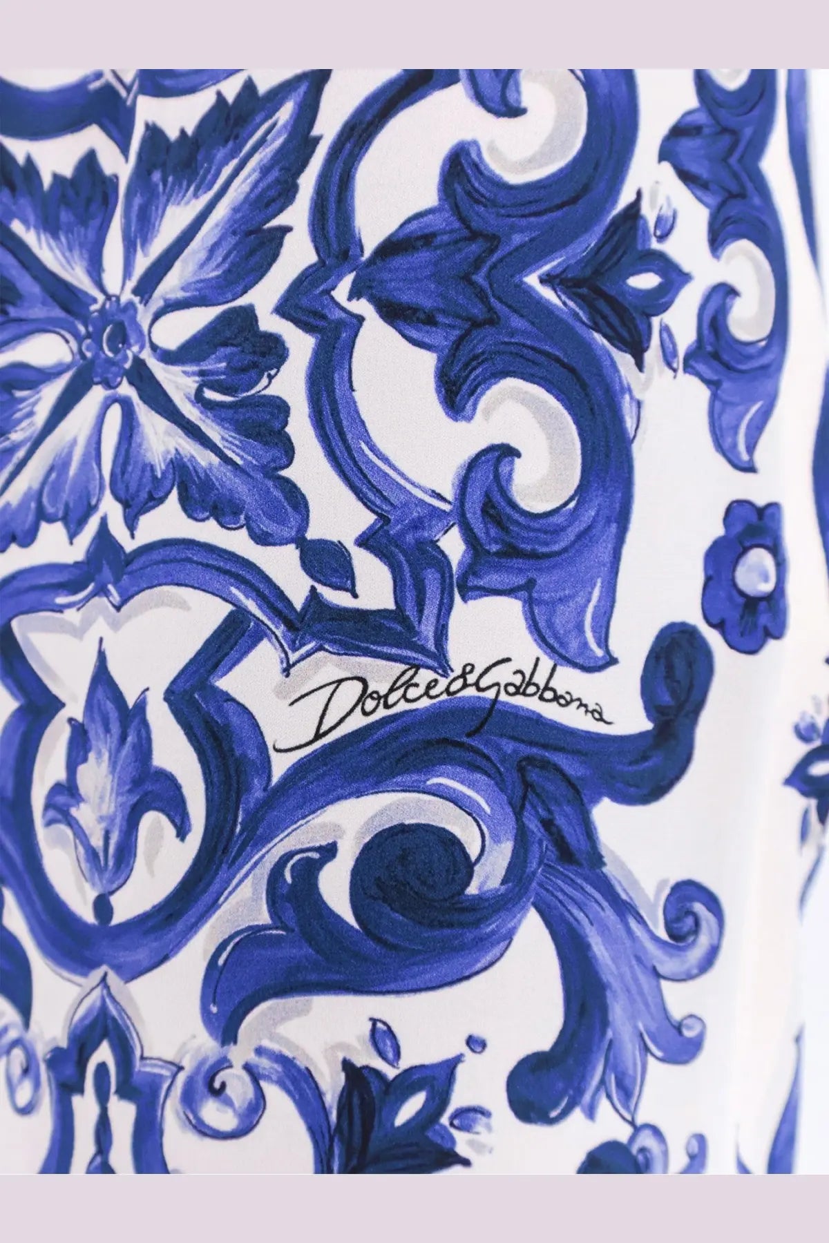 Dolce and gabbana women’s silk trousers blue with white fabric and intricate blue and navy floral scrollwork patterns