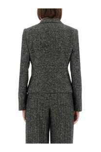 Dolce &amp; Gabbana women’s single breasted charcoal gray tweed blazer with subtle speckled texture and structured shoulders
