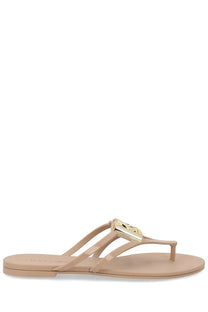Dolce &amp; Gabbana women’s beige rubber flip-flop slide with gold-tone metallic logo buckle