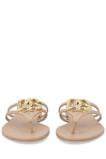 Dolce &amp; Gabbana women’s beige rubber flip-flops with gold-tone interlocking logo clasp slide style