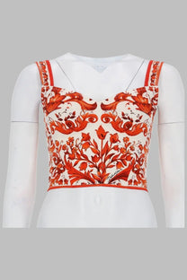 Dolce &amp; Gabbana women’s orange and white floral crop top bustier in charmeuse with baroque-inspired print on mannequin