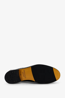 Black leather doucals men’s adler loafers with a contrasting yellow rubber sole and douglas branding visible