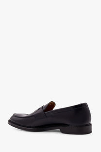 Black leather loafer from Doucal’s featuring a polished finish and classic slip-on penny design for men