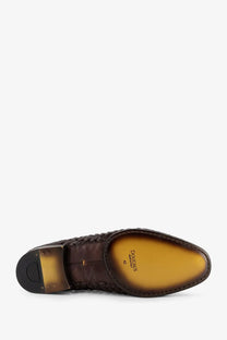 Brown woven leather men’s dress shoe with polished tan insole and black rubber heel from Doucals unique loafers gold collection
