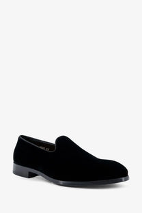 Doucal’s men’s black velvet slip-on loafer with sleek low-profile heel and smooth black rubber sole