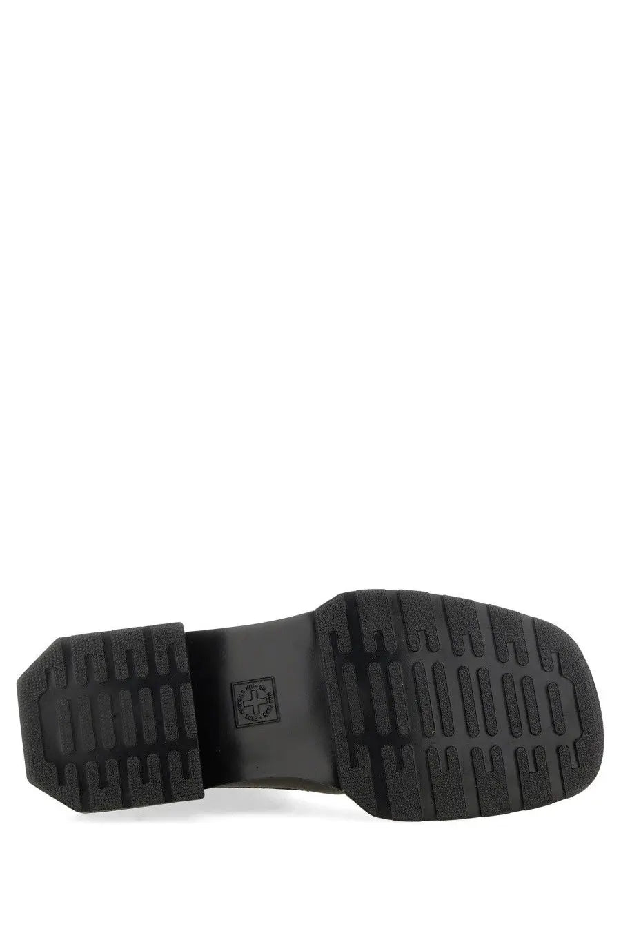 Black rubber sole of dr martens women’s maybole chelsea boot with textured ribbed pattern and embossed logo near heel
