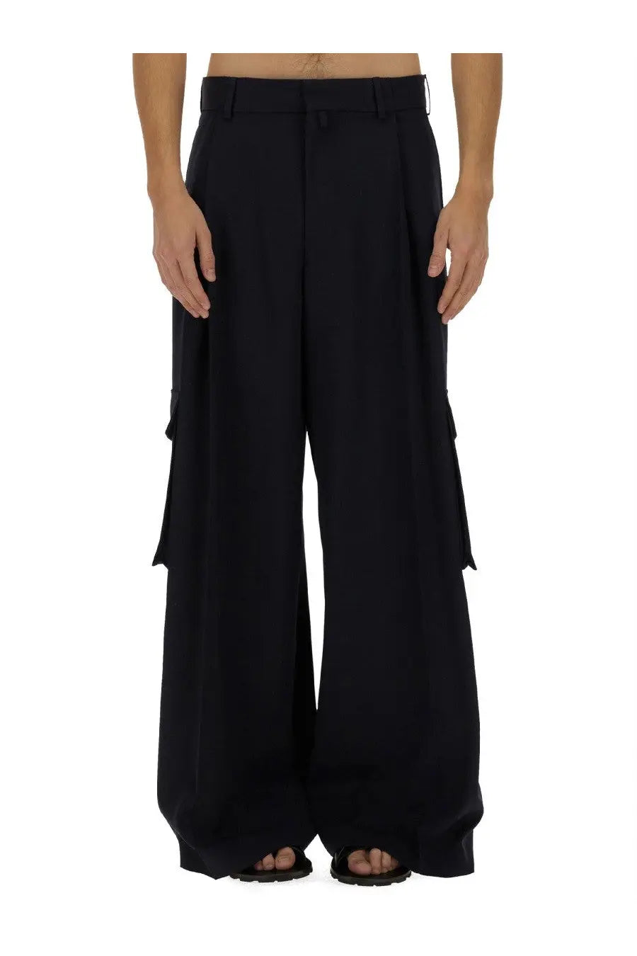 Black wide-leg cargo pants by dries van noten with large side pockets and structured waistband for men