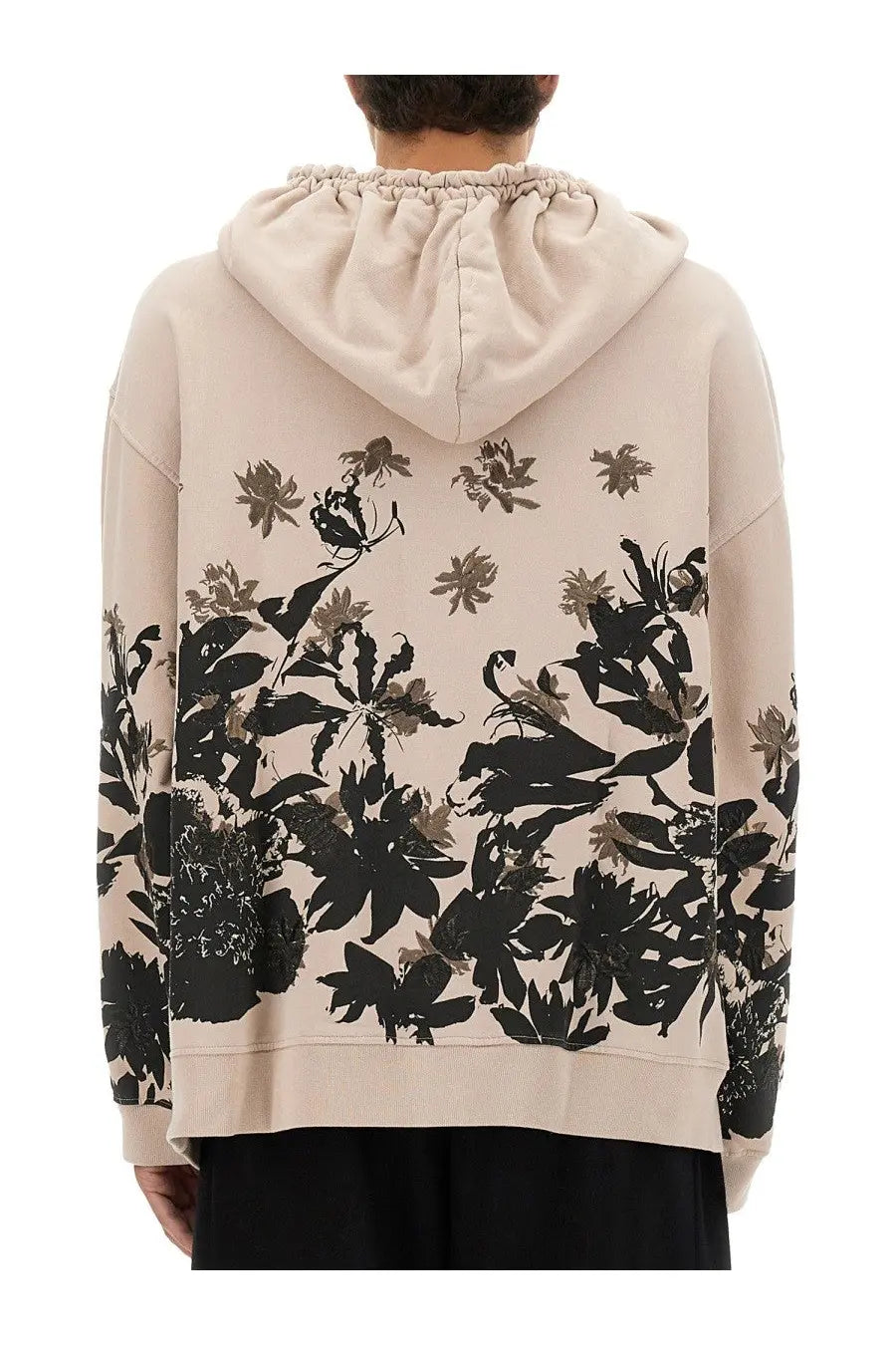Beige cotton dries van noten men’s hoodie with bold black and gray floral print on back and sleeves shown from back side