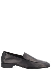 Dries van Noten men’s black leather loafer with sleek minimalist design and low block heel mocassino