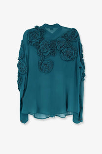 Teal silk blouse by Dries Van Noten featuring dimensional rose appliqués on shoulders and sleeves in viscose blend