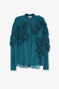Teal silk blouse with dimensional ruffled floral appliqués on sleeves and front by Dries Van Noten women’s Chowsa viscose shirt blue