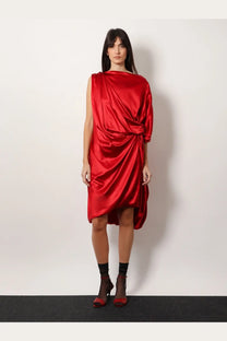 A vibrant red satin one-shoulder dress with draped asymmetrical design by Dries Van Noten