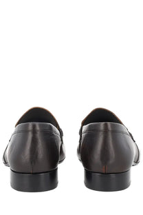 Dark brown leather loafers by Dries Van Noten with sleek minimalist design and black rubber soles for women