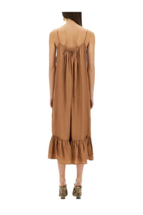 Dries van noten women’s beige silk slip dress with delicate spaghetti straps and ruffled hemline in caramel tone