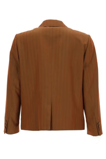 A sleek camel-colored single breasted blazer with smooth fabric finish and classic tailored design by Dries Van Noten