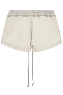Cream-colored denim shorts for women by drkshdw with light gray elastic waistband and matching drawstrings