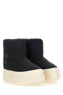 Drkshdw women’s padded black puffer boots with cream platform sole and subtle embroidered logo on the side