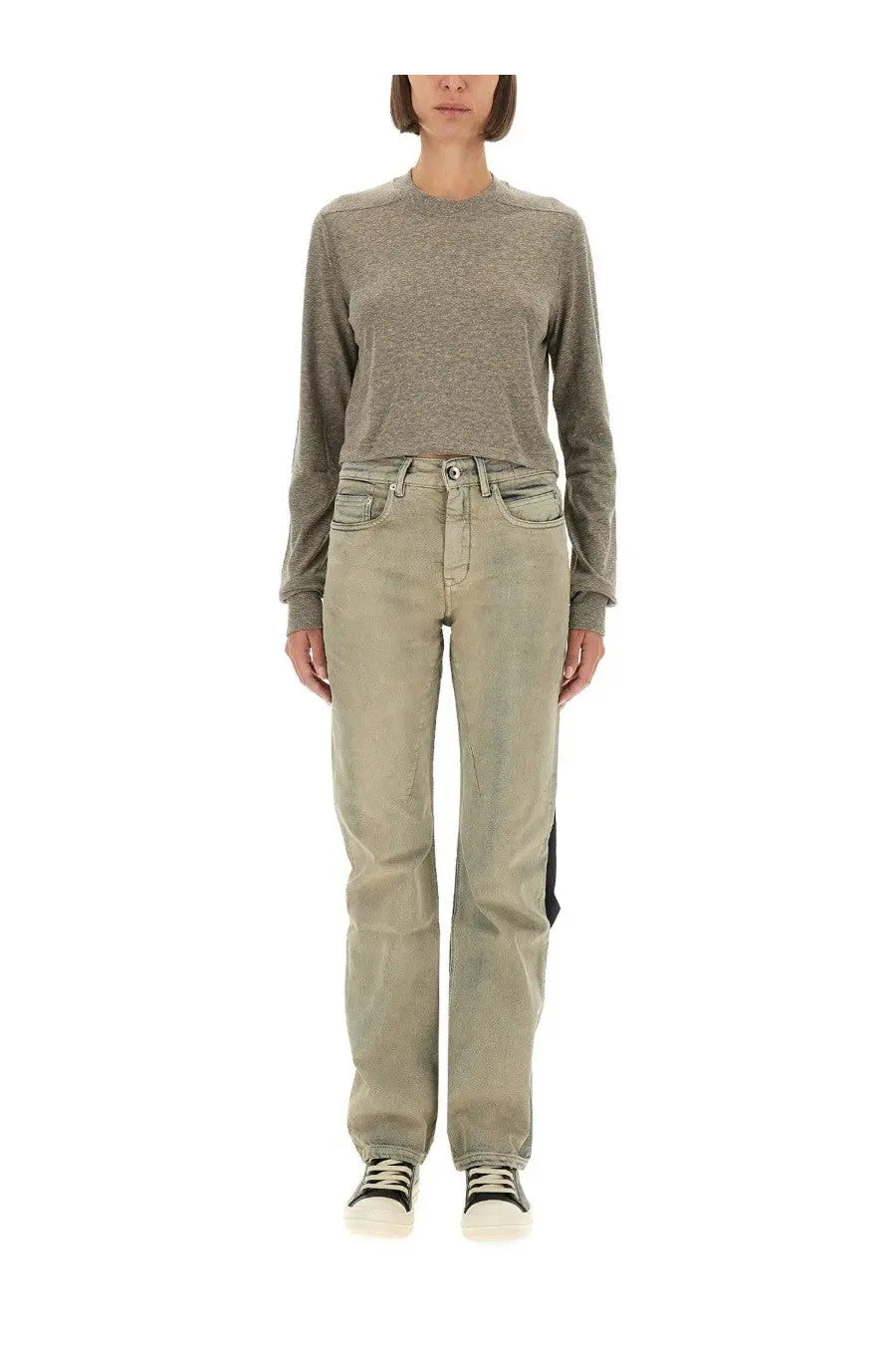 A pair of drkshdw women’s light green straight-leg denim jeans with a subtle faded wash and black thigh patch