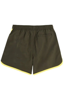 Drôle de monsieur men’s olive green swim trunks with bright yellow trim along hem and side seams