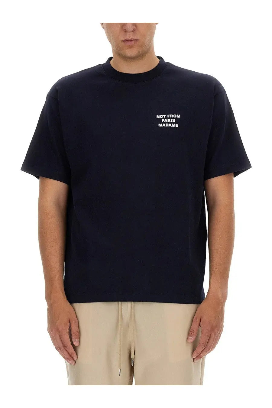 Black short-sleeved cotton t-shirt with white embroidered not from paris madame text by drôle de monsieur