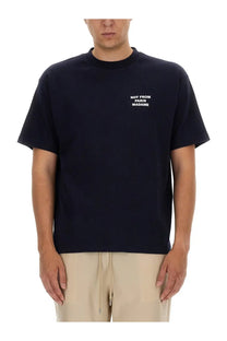 Black short-sleeved cotton t-shirt with white embroidered not from paris madame text by drôle de monsieur