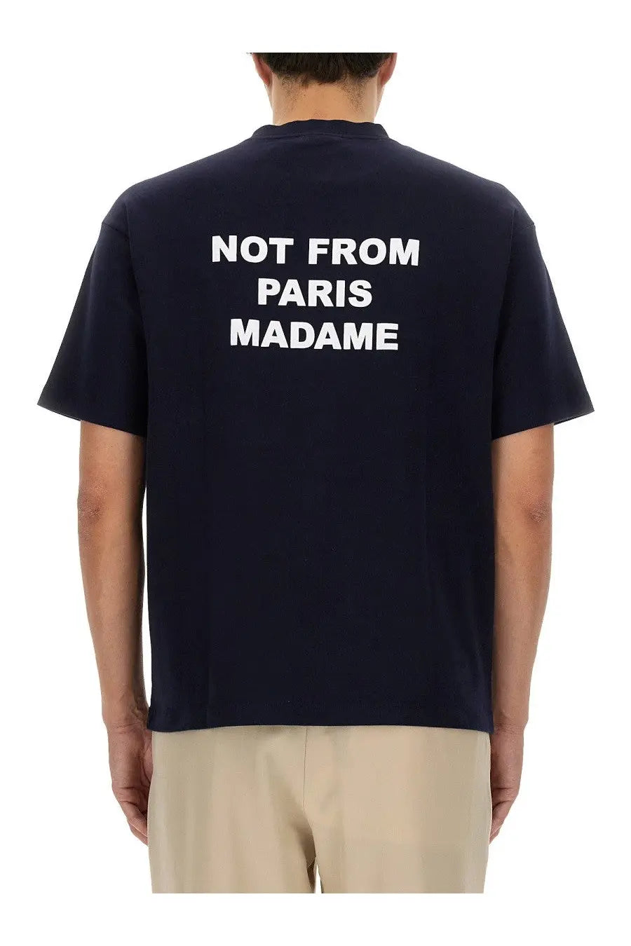 Back of navy blue cotton short-sleeved t-shirt with white not from paris madame text by drôle de monsieur