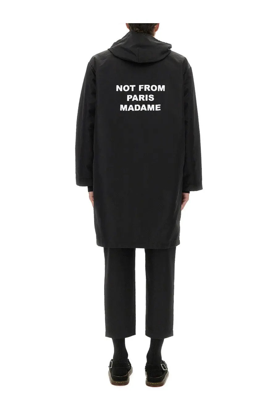 Back side of drôle de monsieur men’s black hooded parka coat with white not from paris madame text on the back