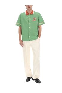 Drôle de monsieur men’s green short-sleeved button-up shirt with orange trim and red embroidered d on chest