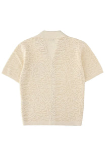 Cream-colored short-sleeved knit cardigan with a subtle leaf pattern and collar from drôle de monsieur beige maille dentelle shirt