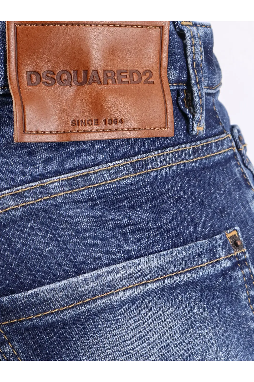 Blue denim dsquared2 men’s cool guy stretch cotton jeans with brown leather patch embossed with brand name on back