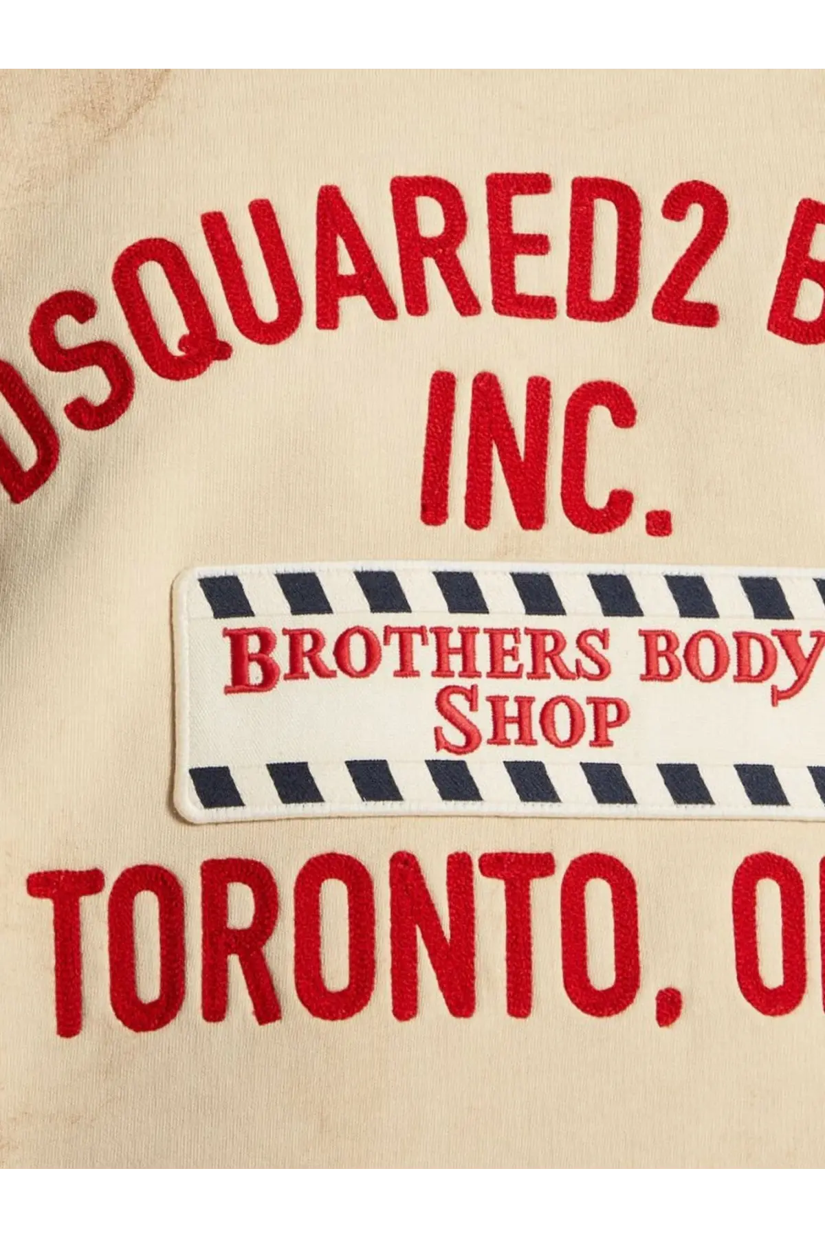 Beige dsquared2 men’s cotton sweatshirt with red embroidered lettering and white patch with black striped borders