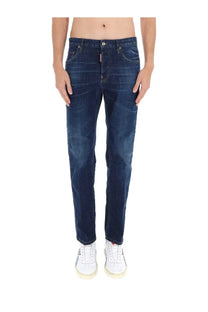 Dark blue slim fit denim jeans with subtle fading and dsquared2 logo on the front right pocket for men