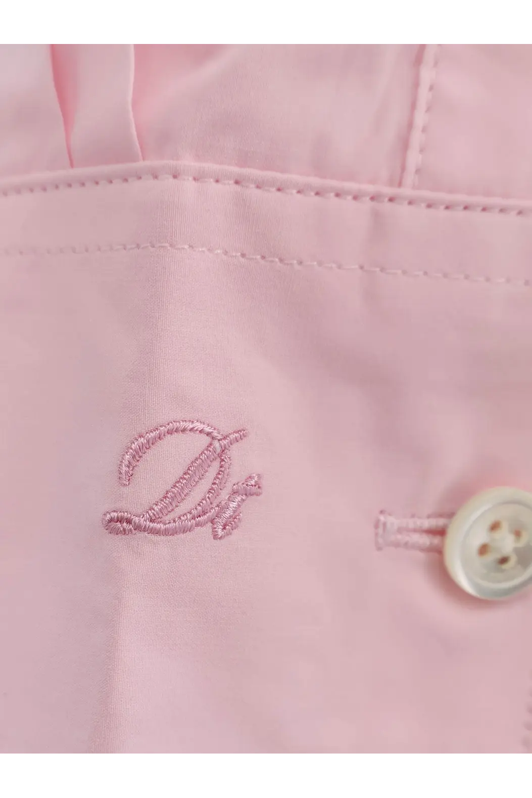 Dunst men’s unisex cotton shirt blue featuring pink embroidered d logo on light pink fabric with off white button