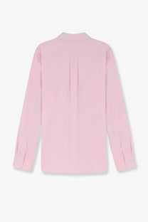 Dunst men’s unisex cotton shirt blue showing the back with a soft pink long-sleeved blouse and subtle pleats
