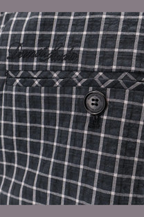 Dark gray and white checkered linen shirt with black dust studio button paired with dunst men’s unisex black pajamas trousers