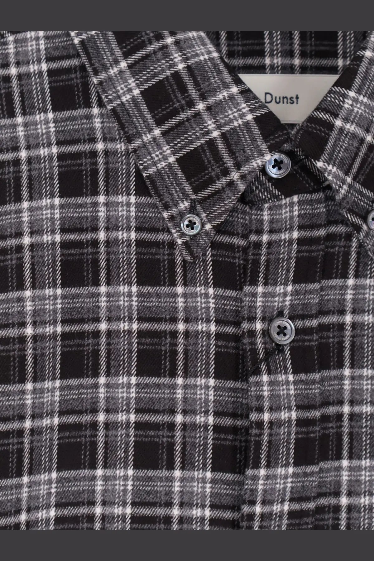 DUNST unisex check flannel shirt black featuring black and white plaid pattern with silver-toned buttons