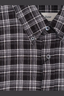 DUNST unisex check flannel shirt black featuring black and white plaid pattern with silver-toned buttons