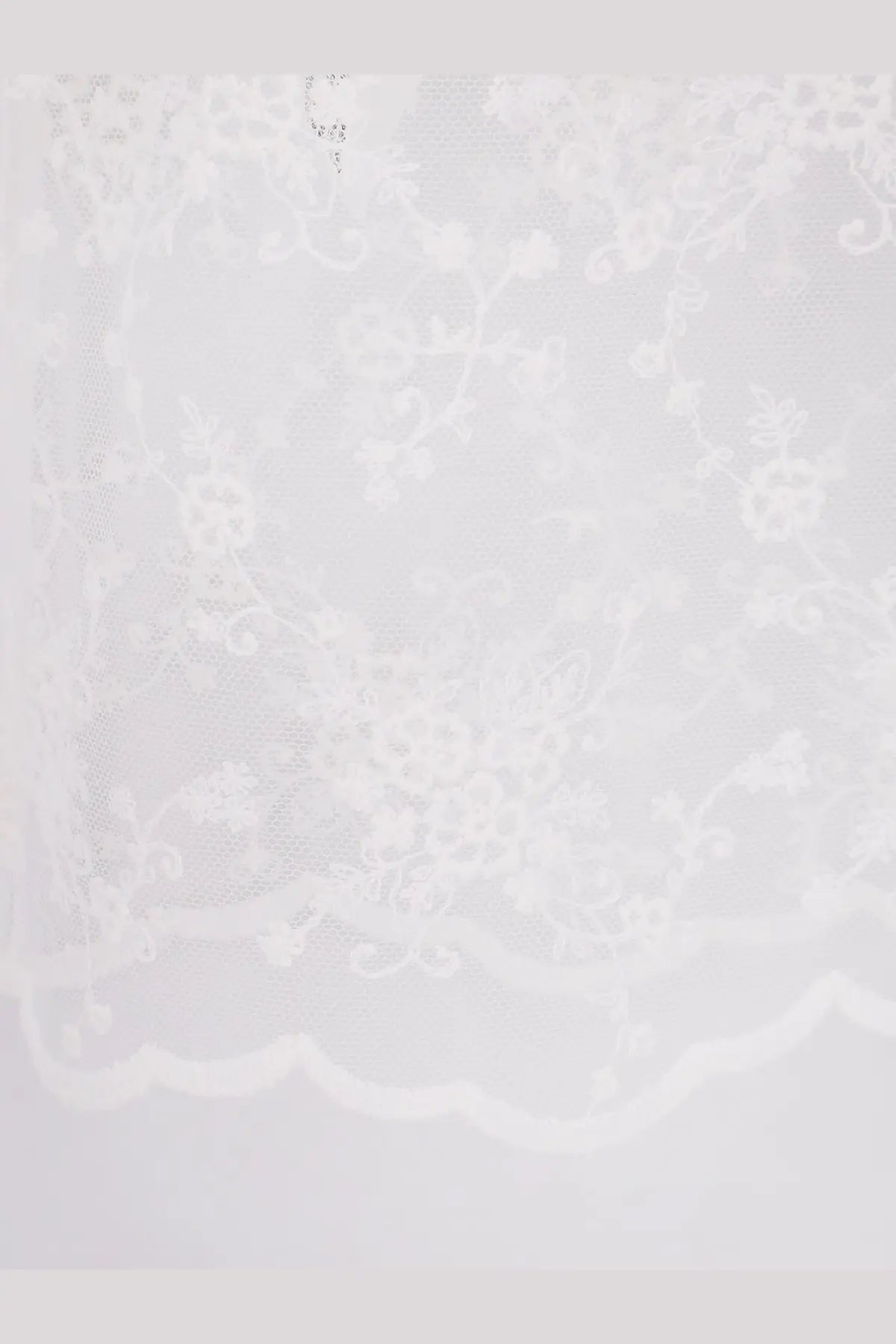 White lace fabric with delicate floral embroidery and scalloped edge from dunst women’s needlework layering skirt white