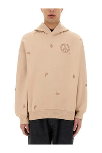 Beige Emporio Armani men’s hooded sweatshirt with embroidered paisley and peace sign motifs in soft fabric