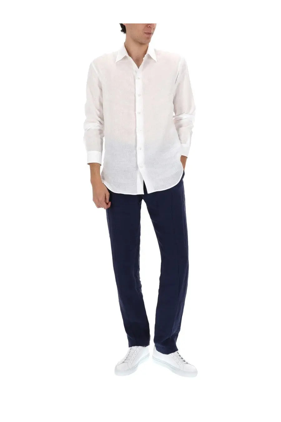 White linen button-down shirt with classic collar and rolled-up sleeves paired with emporio armani blue linen pants